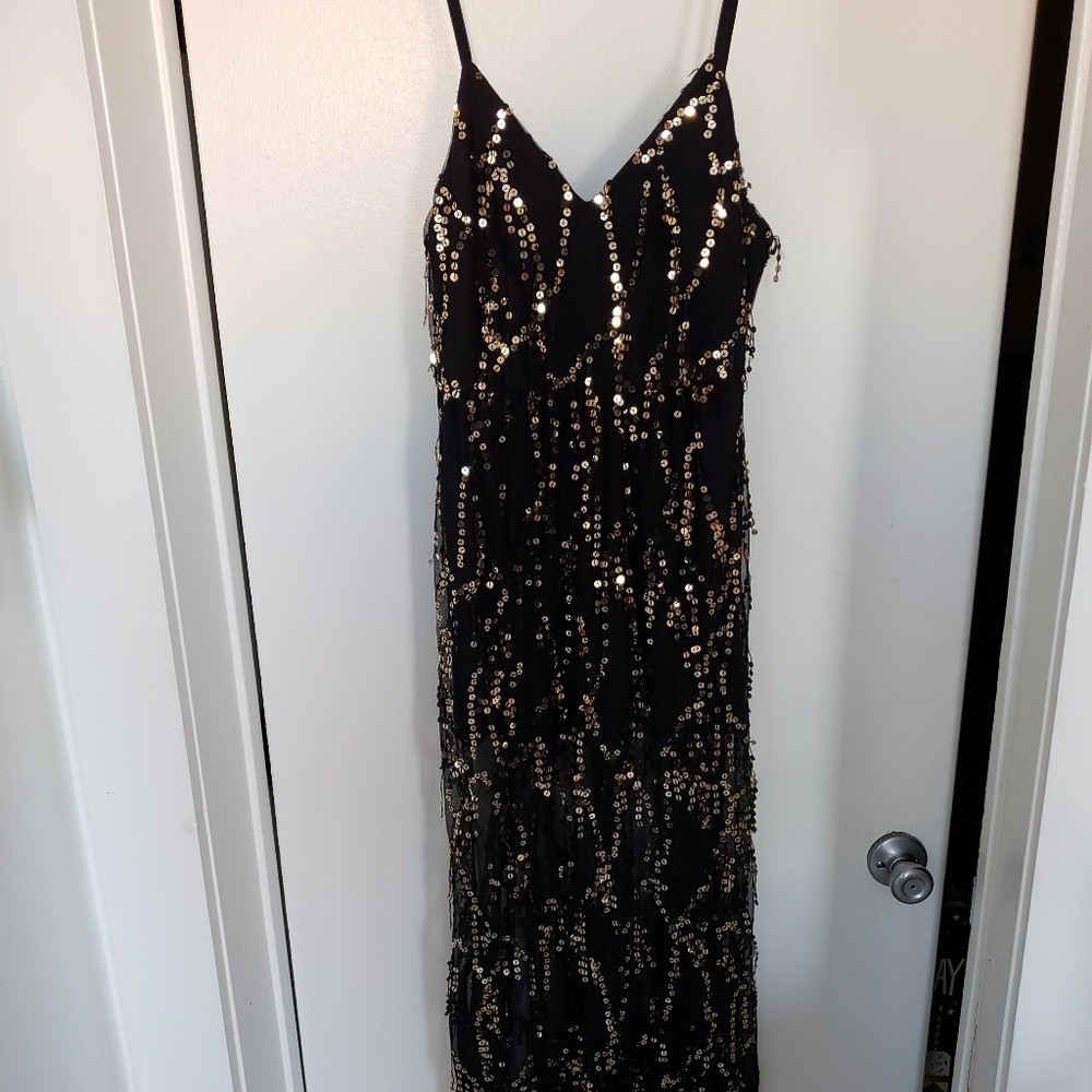 Black dress with gold sequin tassels